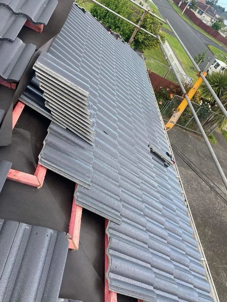 Concrete tile re-roofing in progress Auckland